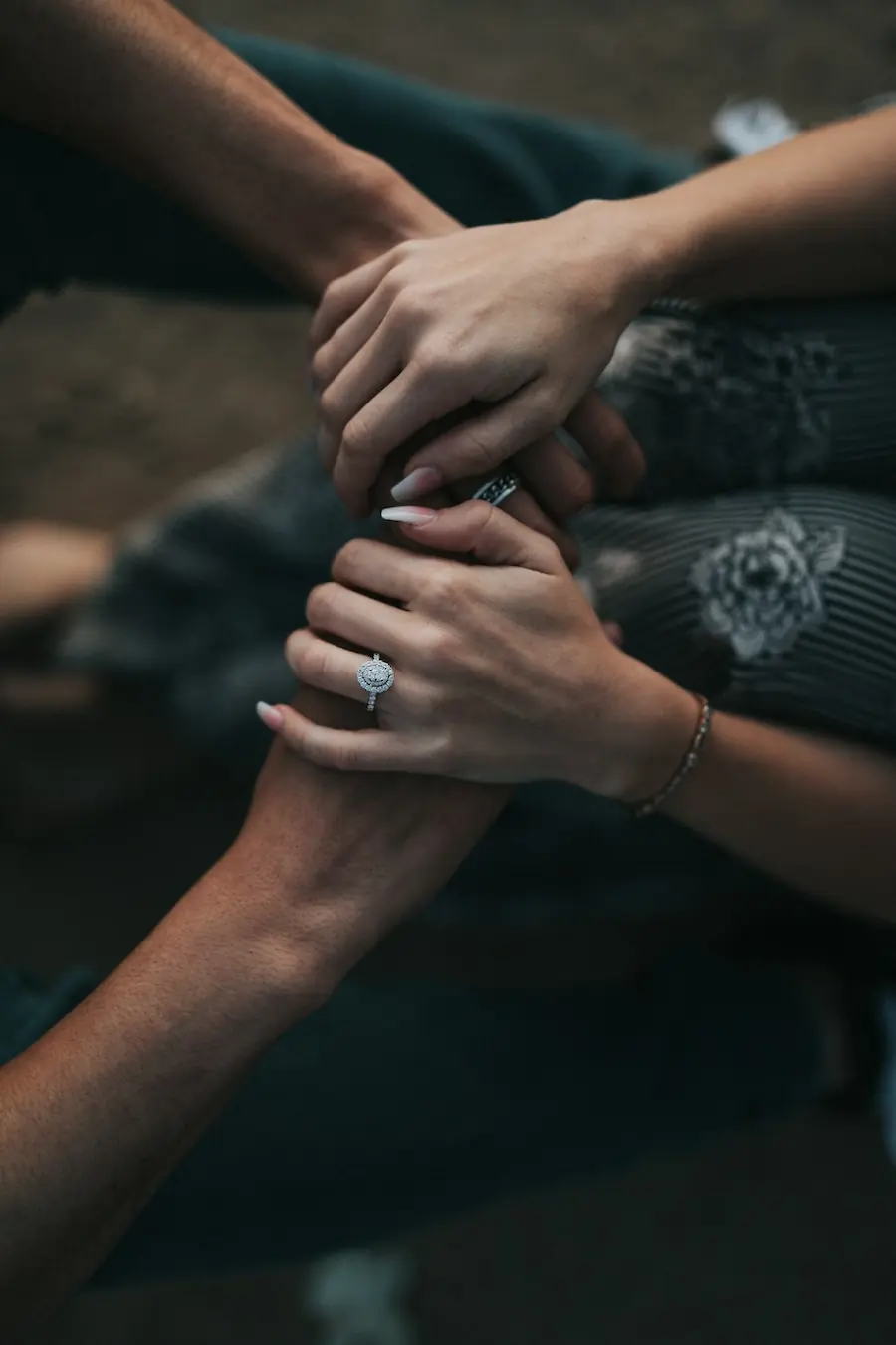 man and woman holding each others hands. Photo by Nathan Dumlao, Unsplash.